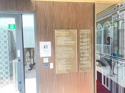 a door to a building with a sign on it at The Base Central - Luxury Resort-Style Comfort in Ban Rangeng
