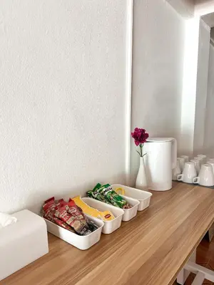 a table with three containers of food on it at MONTANA Hotel & Hostel Phuket in Karon Beach