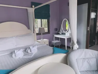 a bedroom with a white bed and a mirror at Siam Jewel - Private pool villa in Bang Tao in Bang Tao Beach