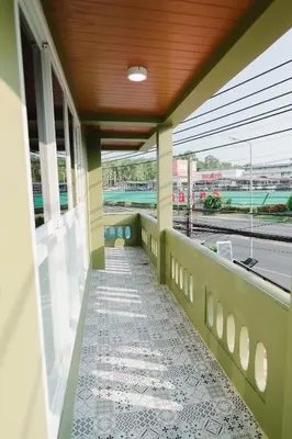 a balcony with a view of a train station at Kai Mook House in Ban Ket Ho